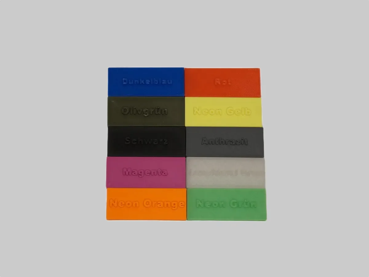Farbmuster der Filamentfarben. Für den Schuhclip wählbar: Neon Orange, Neon Gelb, Anthrazit, Olivgrün, Dunkelblau, Schwarz, Rot und Magenta